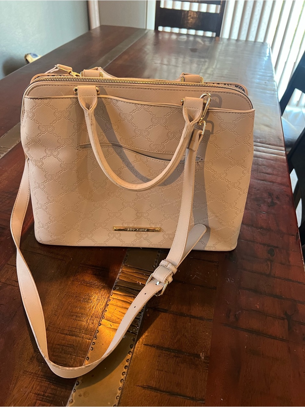Betsey Johnson satchel handbag featuring an embossed heart pattern